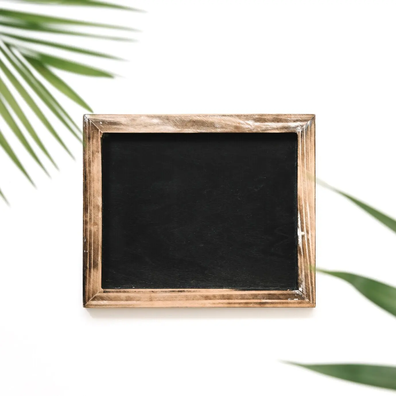 View from above of a black slate on a white background.